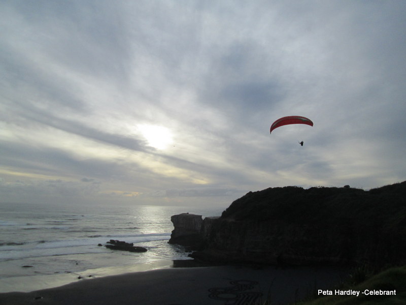 Paraglider at Muriwai Sunset